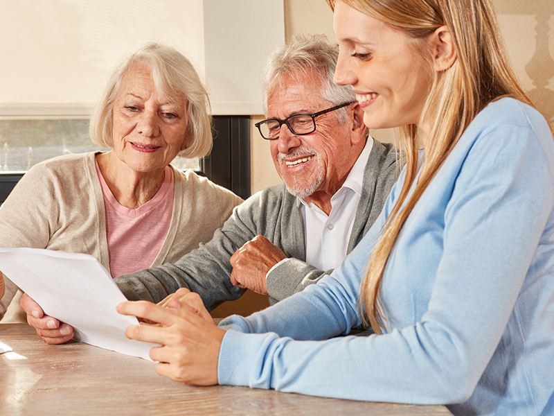 Affinity Homecare. About us - services we offer. Elderly couple discussing their care plan with a care manager.